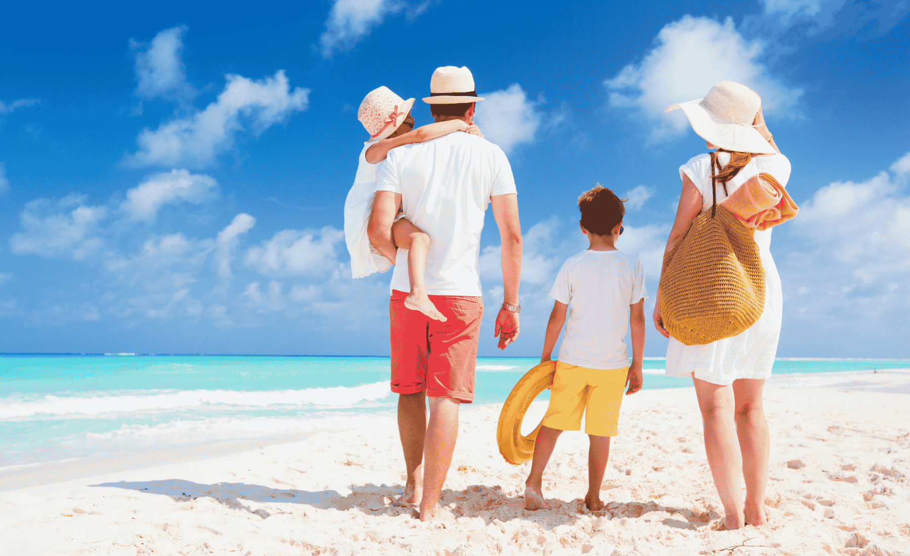 Family with kids on a Caribbean beach