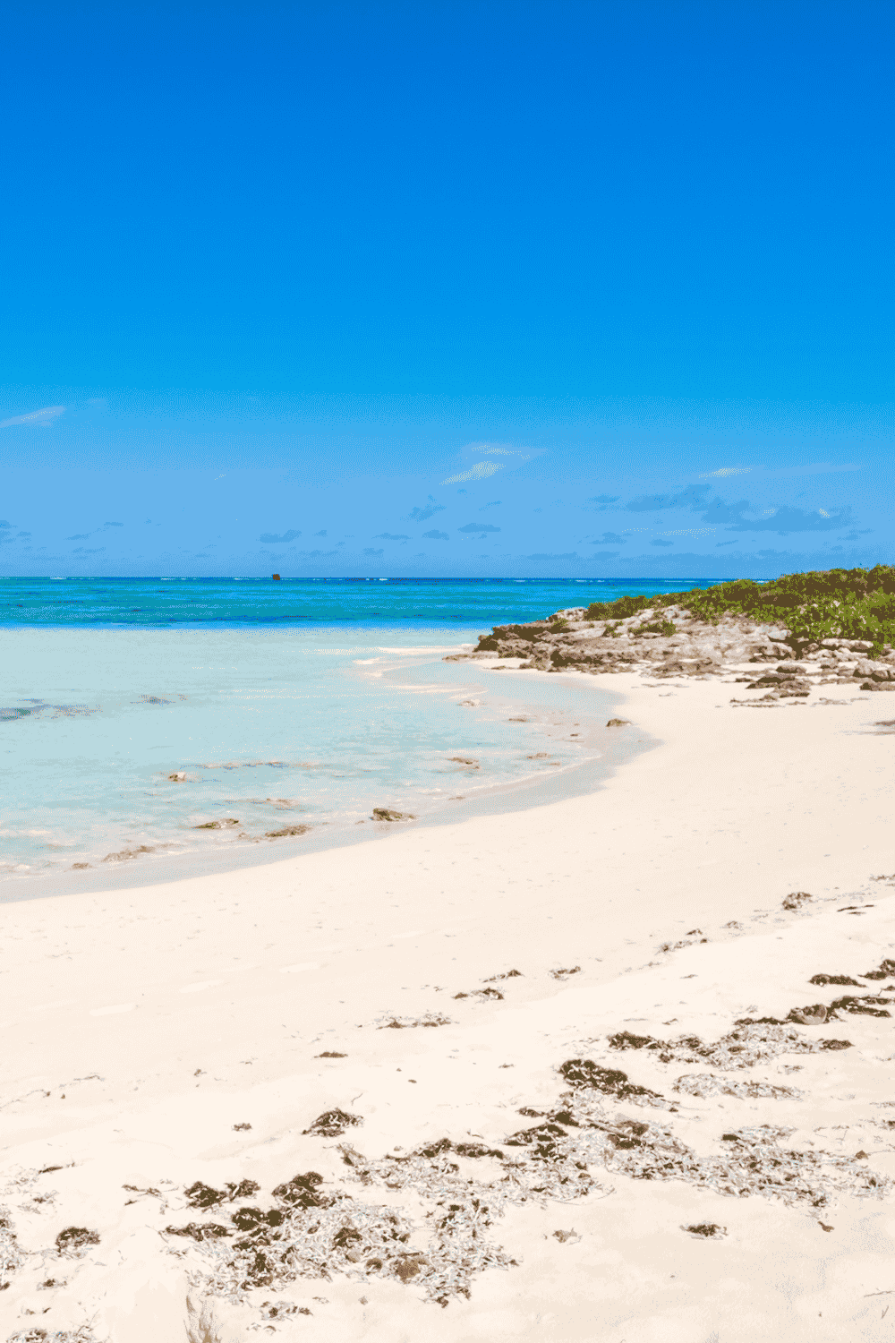 Pumpkin Bluff Beach with white sand and turquoise water in North Caicos Turks and Caicos