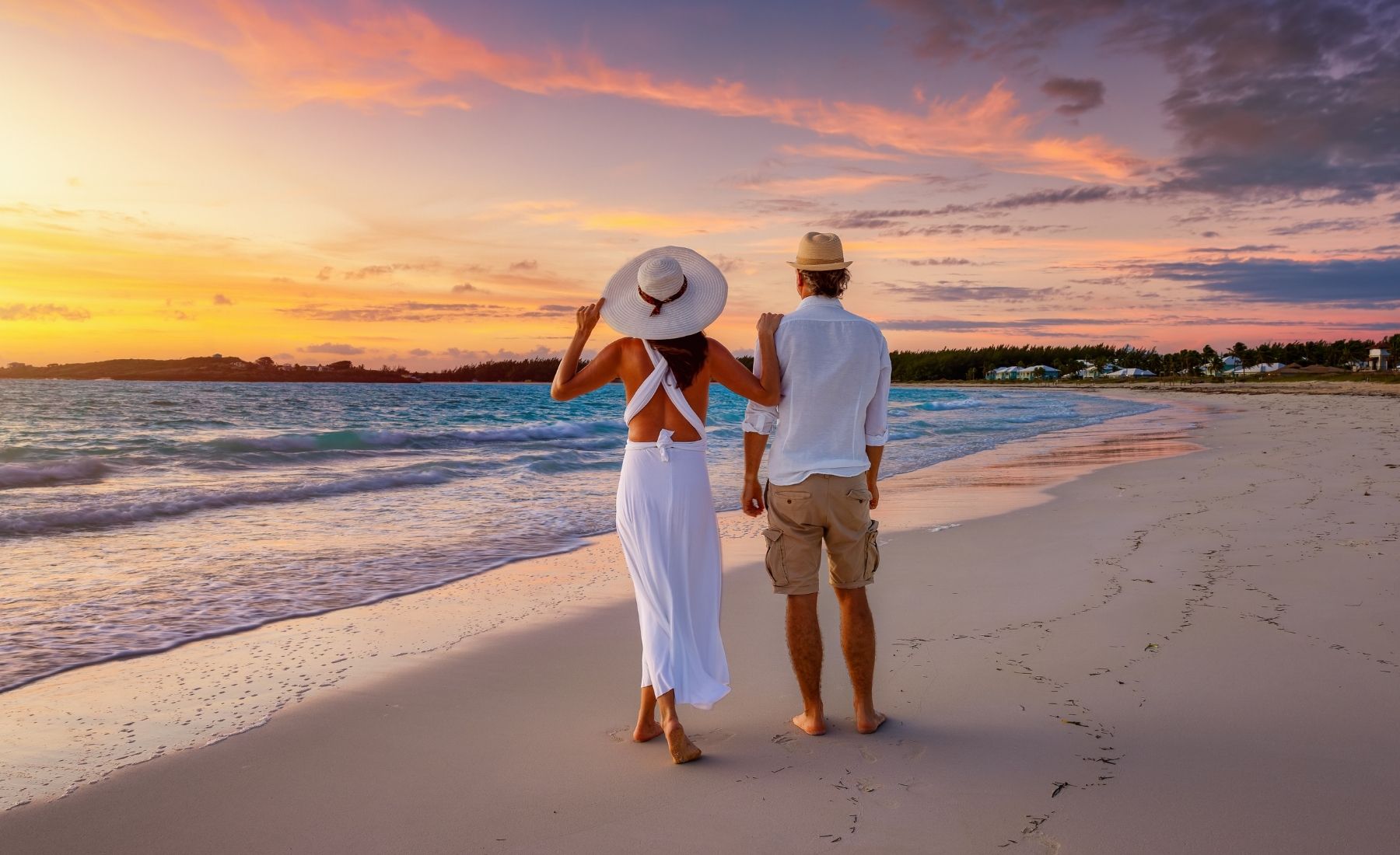 Couple walking on the beach in the Bahamas